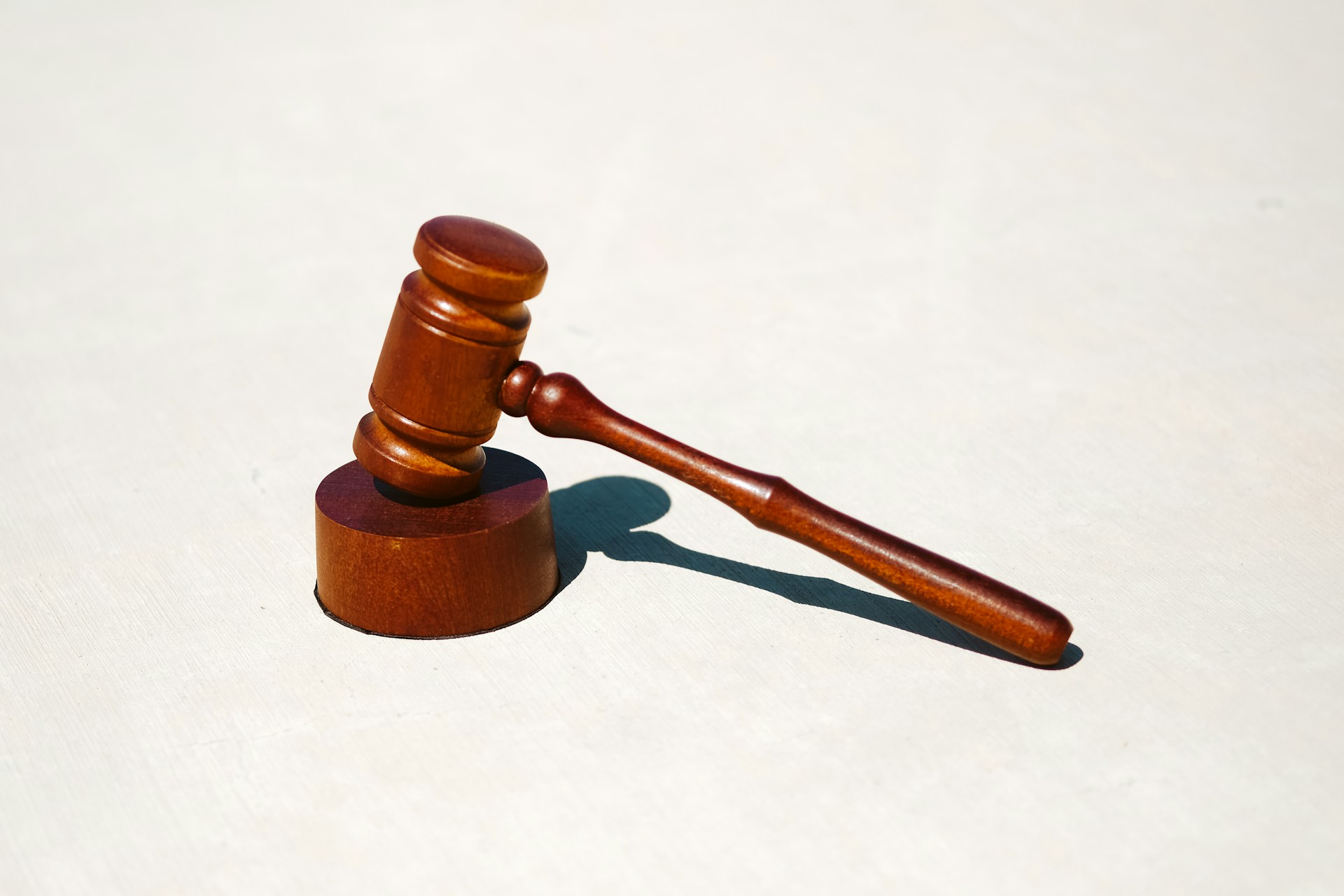 A wooden gavel on a stand